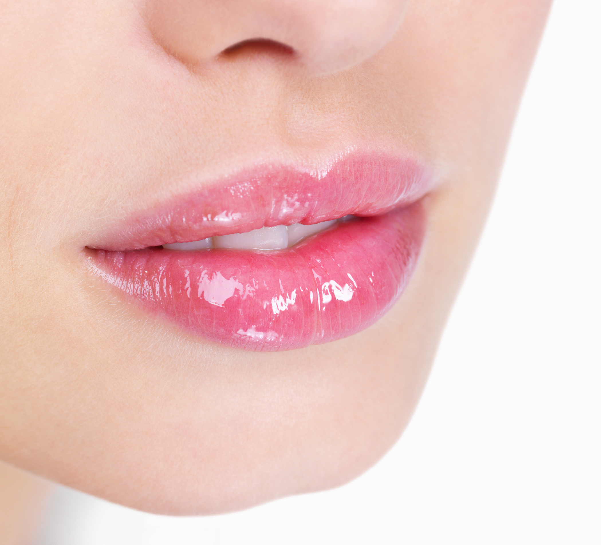 Young woman's glossy pink lips-copyspace